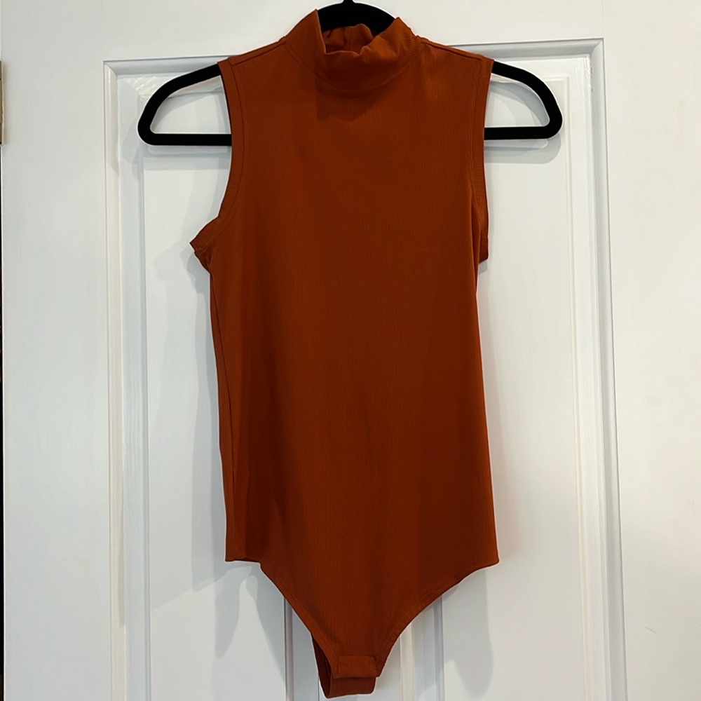 Spanx size small bodysuit ribbed. Rust:orange color.